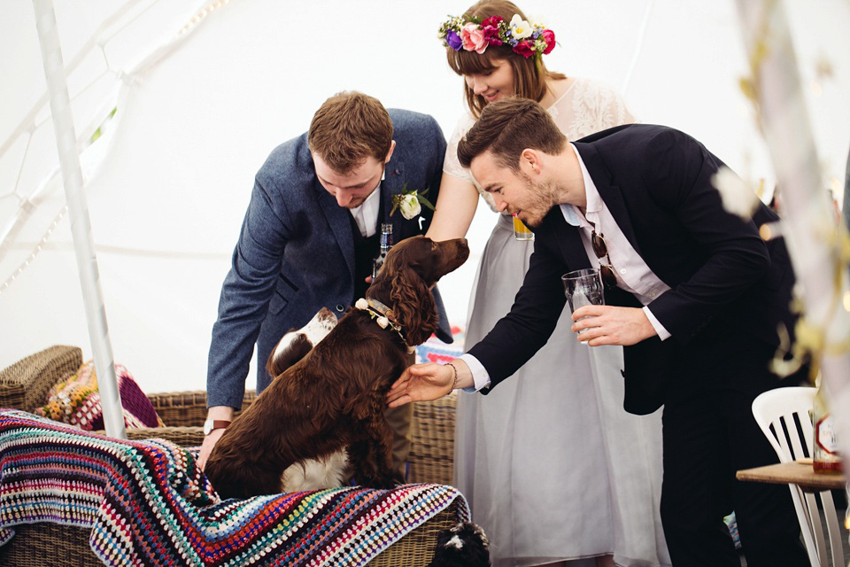 The bride wears a top and skirt for her charming orchard wedding. Photography by Cat Lane.