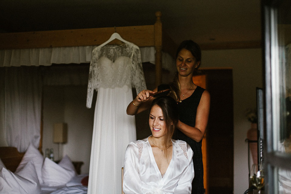 The bride wears Sarah Seven and a Ru de Seine lace blouse for her Boho Rustic Bavarian Farmhouse wedding. Photography by Kevin Klein.