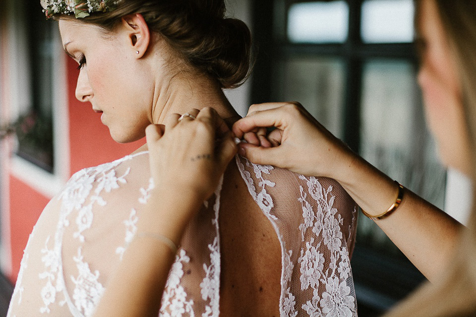 The bride wears Sarah Seven and a Ru de Seine lace blouse for her Boho Rustic Bavarian Farmhouse wedding. Photography by Kevin Klein.