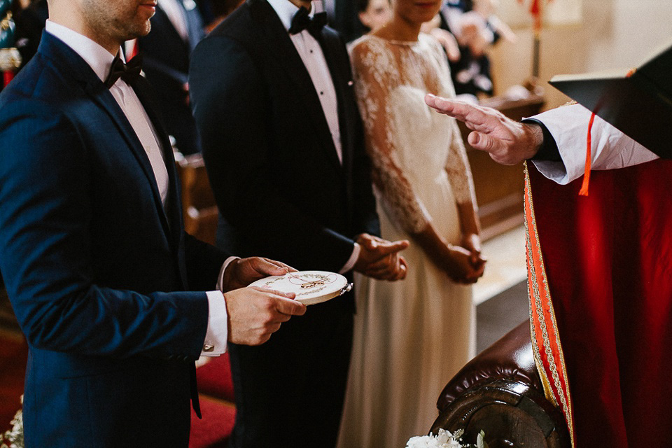 The bride wears Sarah Seven and a Ru de Seine lace blouse for her Boho Rustic Bavarian Farmhouse wedding. Photography by Kevin Klein.