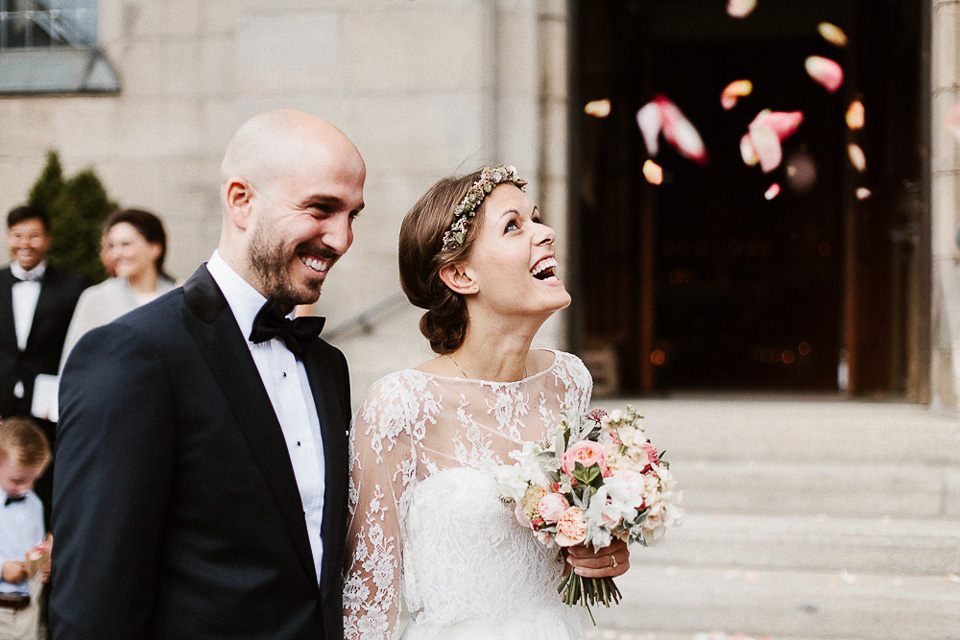 The bride wears Sarah Seven and a Ru de Seine lace blouse for her Boho Rustic Bavarian Farmhouse wedding. Photography by Kevin Klein.