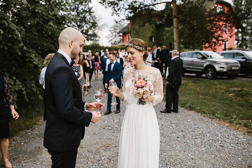 The bride wears Sarah Seven and a Ru de Seine lace blouse for her Boho Rustic Bavarian Farmhouse wedding. Photography by Kevin Klein.