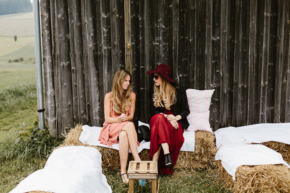 The bride wears Sarah Seven and a Ru de Seine lace blouse for her Boho Rustic Bavarian Farmhouse wedding. Photography by Kevin Klein.