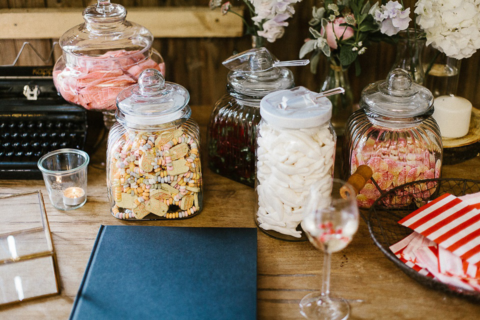 The bride wears Sarah Seven and a Ru de Seine lace blouse for her Boho Rustic Bavarian Farmhouse wedding. Photography by Kevin Klein.