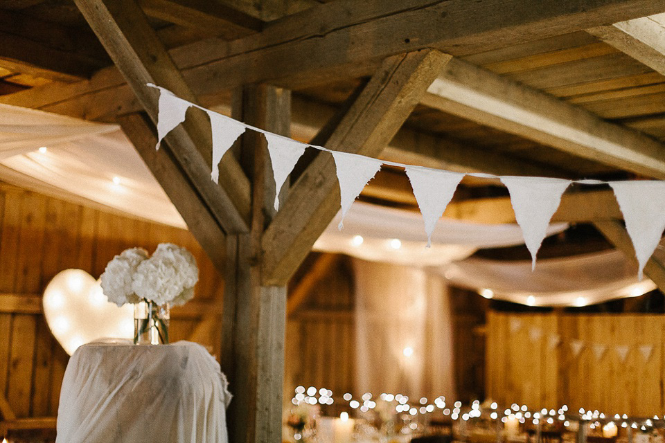 The bride wears Sarah Seven and a Ru de Seine lace blouse for her Boho Rustic Bavarian Farmhouse wedding. Photography by Kevin Klein.