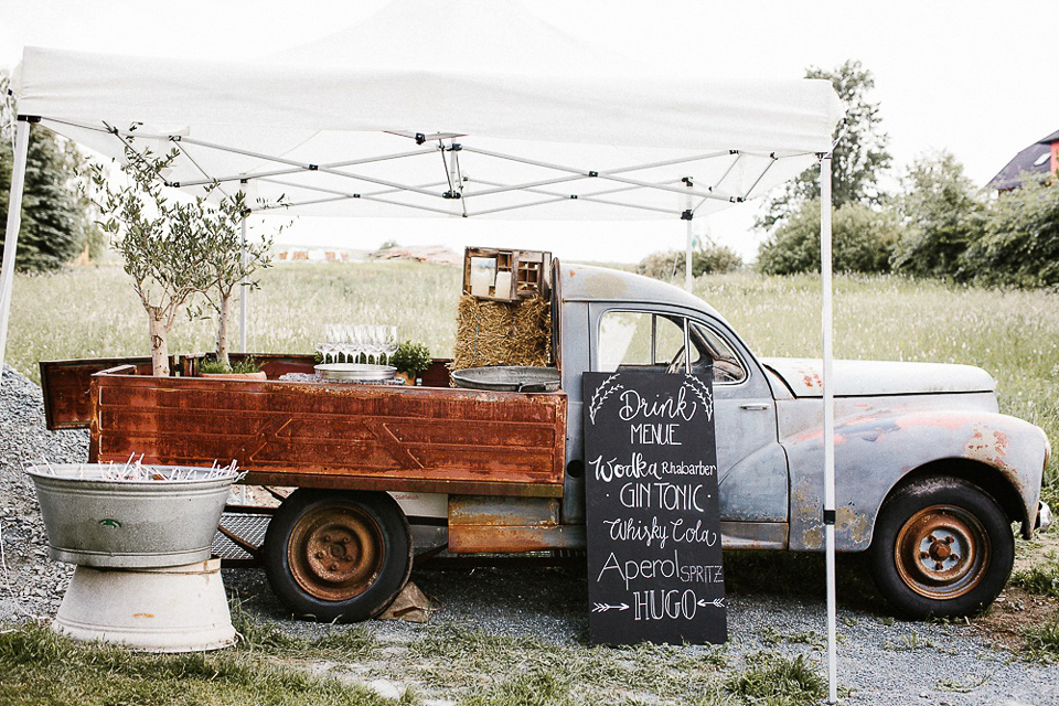 The bride wears Sarah Seven and a Ru de Seine lace blouse for her Boho Rustic Bavarian Farmhouse wedding. Photography by Kevin Klein.