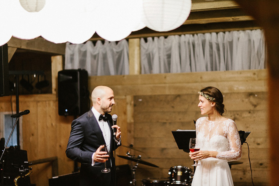 The bride wears Sarah Seven and a Ru de Seine lace blouse for her Boho Rustic Bavarian Farmhouse wedding. Photography by Kevin Klein.