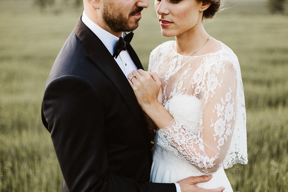 The bride wears Sarah Seven and a Ru de Seine lace blouse for her Boho Rustic Bavarian Farmhouse wedding. Photography by Kevin Klein.