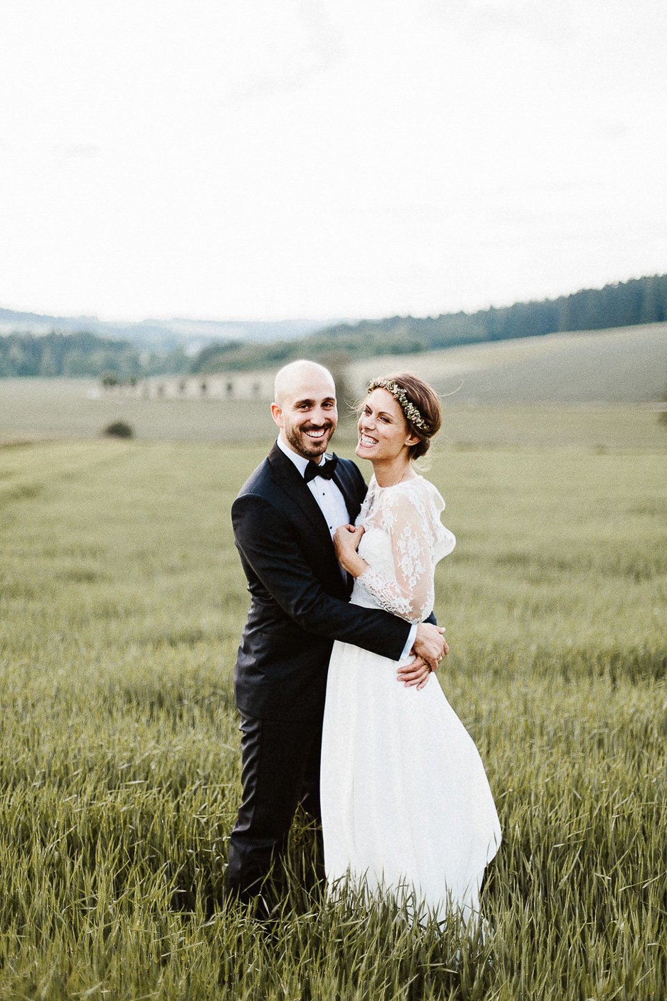 The bride wears Sarah Seven and a Ru de Seine lace blouse for her Boho Rustic Bavarian Farmhouse wedding. Photography by Kevin Klein.