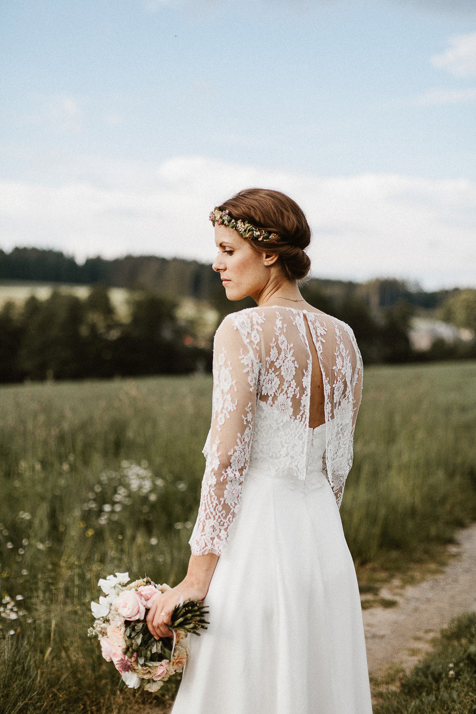 The bride wears Sarah Seven and a Ru de Seine lace blouse for her Boho Rustic Bavarian Farmhouse wedding. Photography by Kevin Klein.