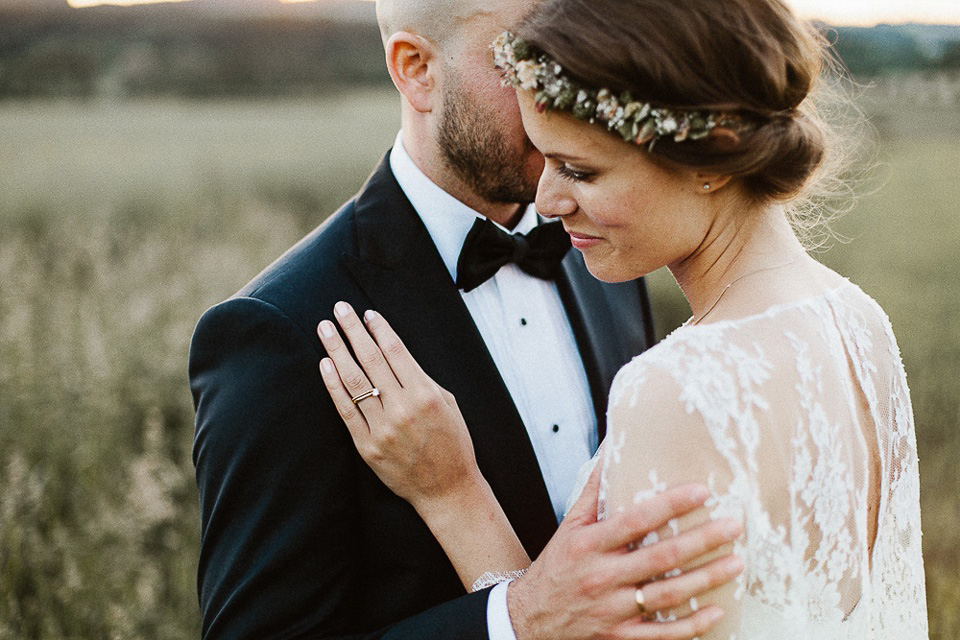 The bride wears Sarah Seven and a Ru de Seine lace blouse for her Boho Rustic Bavarian Farmhouse wedding. Photography by Kevin Klein.