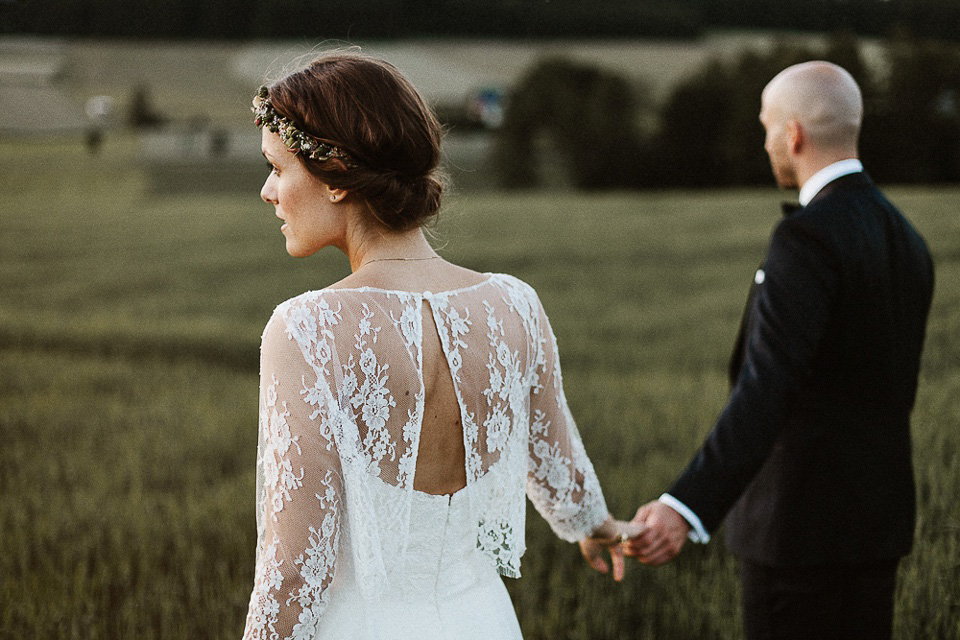 The bride wears Sarah Seven and a Ru de Seine lace blouse for her Boho Rustic Bavarian Farmhouse wedding. Photography by Kevin Klein.
