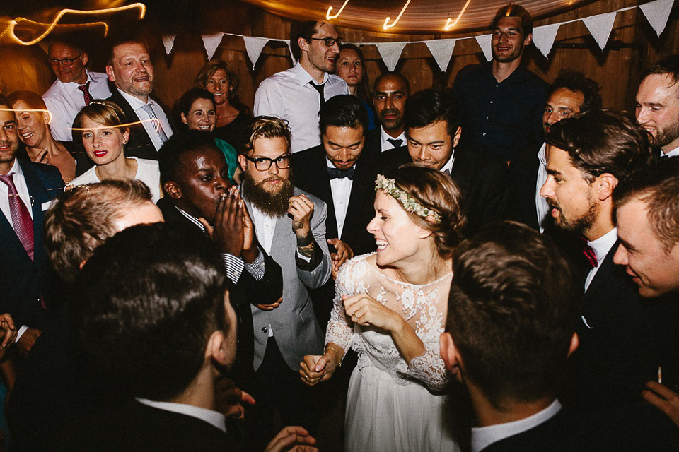 The bride wears Sarah Seven and a Ru de Seine lace blouse for her Boho Rustic Bavarian Farmhouse wedding. Photography by Kevin Klein.