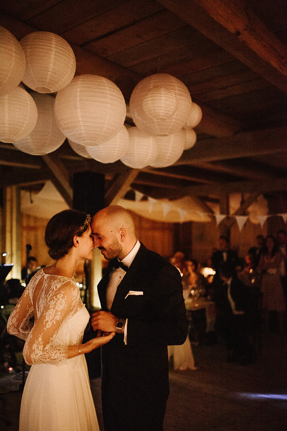 The bride wears Sarah Seven and a Ru de Seine lace blouse for her Boho Rustic Bavarian Farmhouse wedding. Photography by Kevin Klein.