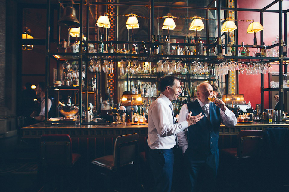 The bride wears a Belle & Bunty gown in blush for her child and family friendly wedding at Trinity Buoy Wharf in London. Photography by Kat Green.