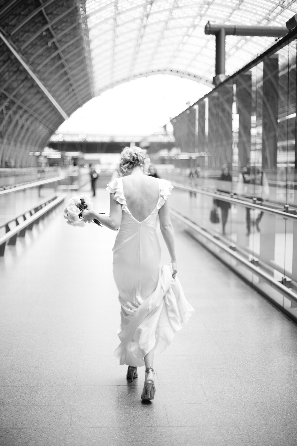 The bride wears a Belle & Bunty gown in blush for her child and family friendly wedding at Trinity Buoy Wharf in London. Photography by Kat Green.