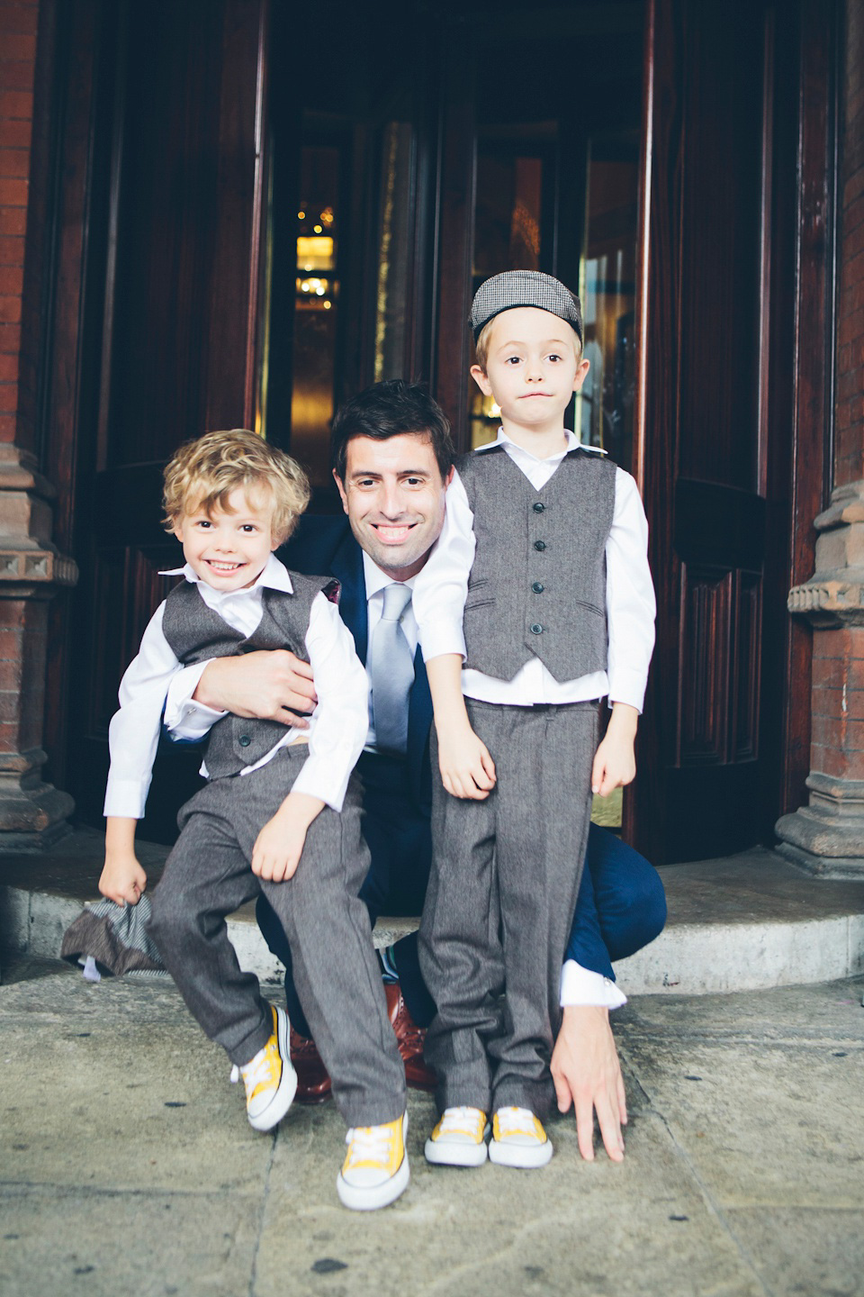 The bride wears a Belle & Bunty gown in blush for her child and family friendly wedding at Trinity Buoy Wharf in London. Photography by Kat Green.