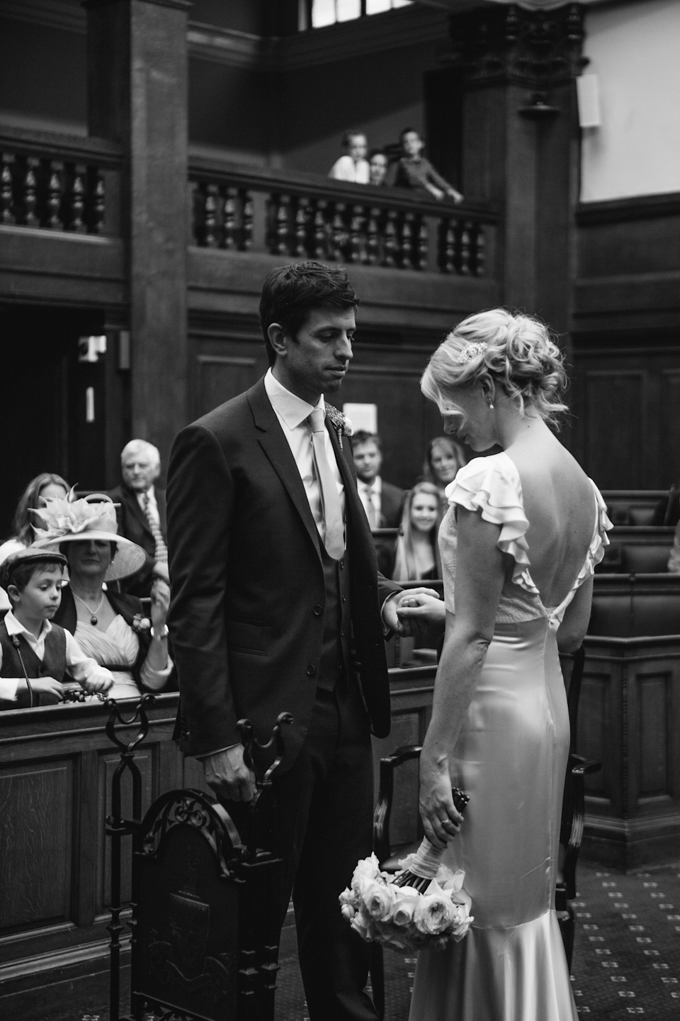 The bride wears a Belle & Bunty gown in blush for her child and family friendly wedding at Trinity Buoy Wharf in London. Photography by Kat Green.