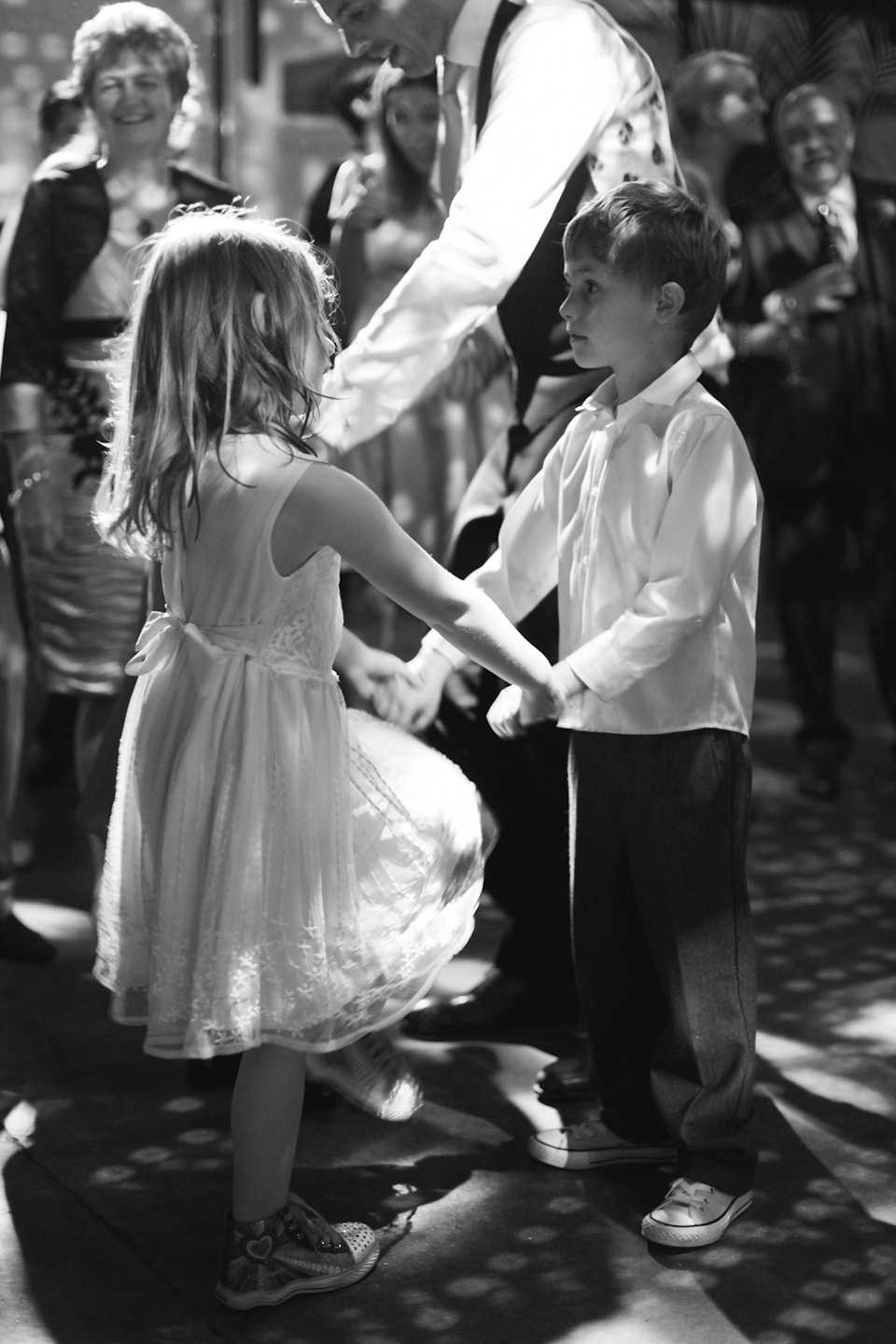 The bride wears a Belle & Bunty gown in blush for her child and family friendly wedding at Trinity Buoy Wharf in London. Photography by Kat Green.