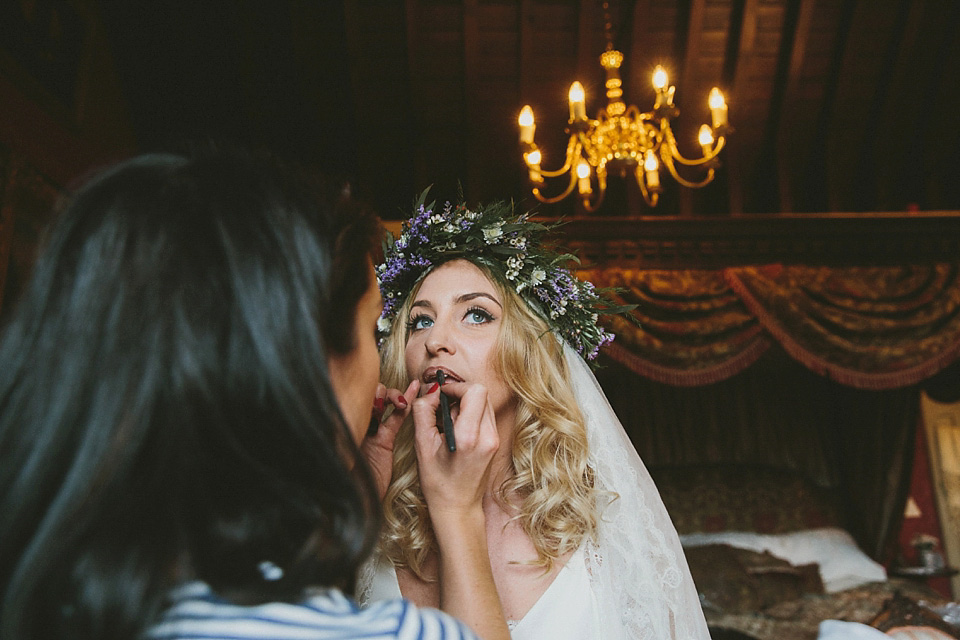 The bride wears a beautiful floral crown and Charlie Brear dress for her house party wedding at Maunsel House in Somerset. Photography by McKinley Rodgers.