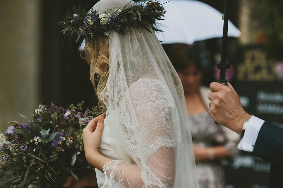 The bride wears a beautiful floral crown and Charlie Brear dress for her house party wedding at Maunsel House in Somerset. Photography by McKinley Rodgers.