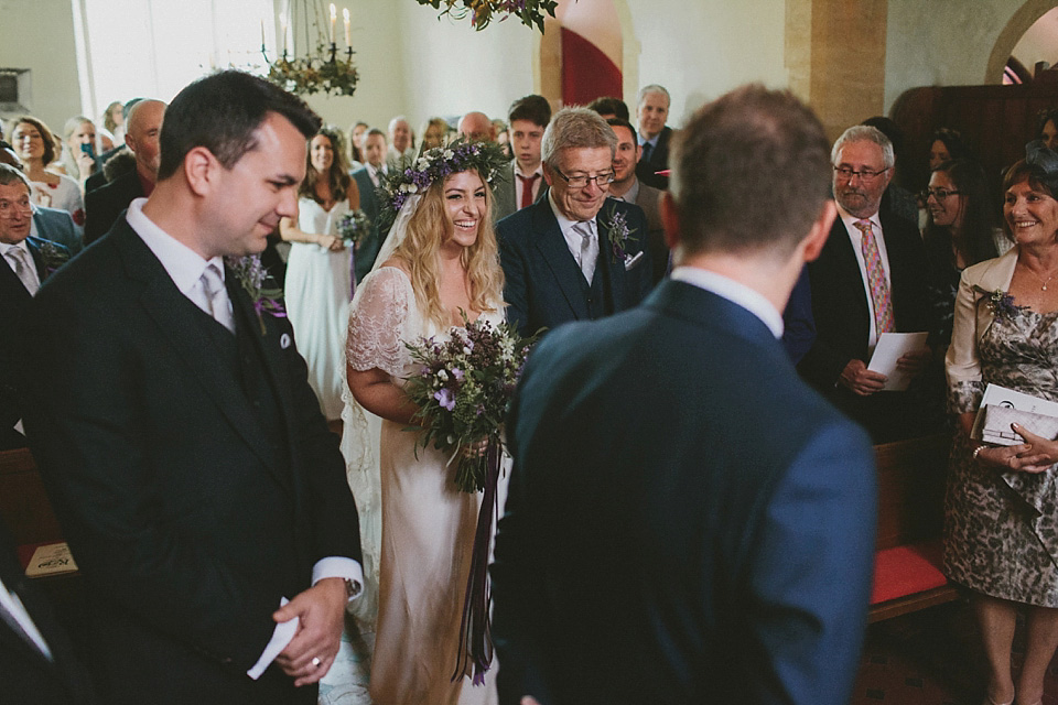 The bride wears a beautiful floral crown and Charlie Brear dress for her house party wedding at Maunsel House in Somerset. Photography by McKinley Rodgers.