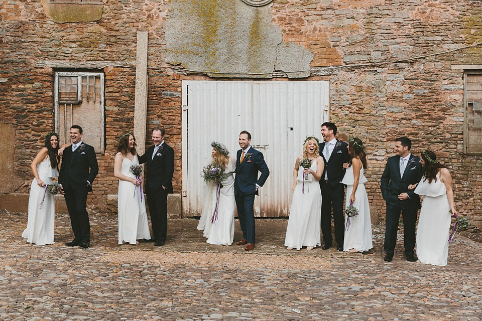 The bride wears a beautiful floral crown and Charlie Brear dress for her house party wedding at Maunsel House in Somerset. Photography by McKinley Rodgers.