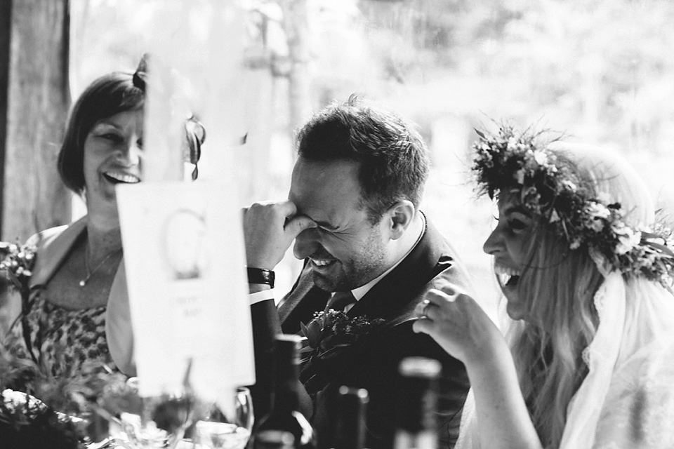 The bride wears a beautiful floral crown and Charlie Brear dress for her house party wedding at Maunsel House in Somerset. Photography by McKinley Rodgers.