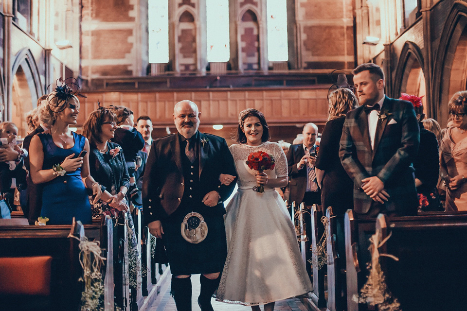 The bride wears green wedding shoes and a 50's style dress from Flossy and Dossy for her Glasgow wedding. Photography by John Elphinstone-Stirling.