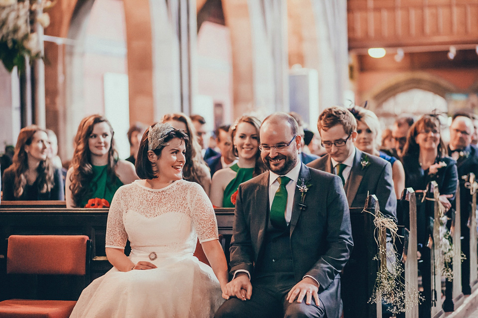 The bride wears green wedding shoes and a 50's style dress from Flossy and Dossy for her Glasgow wedding. Photography by John Elphinstone-Stirling.