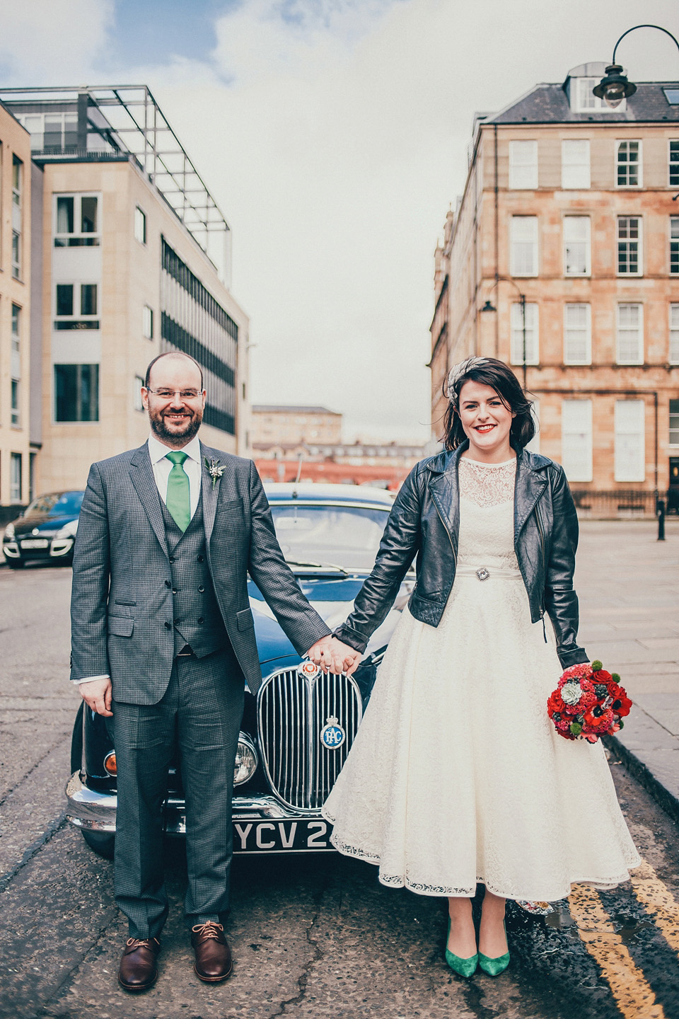 The bride wears green wedding shoes and a 50's style dress from Flossy and Dossy for her Glasgow wedding. Photography by John Elphinstone-Stirling.