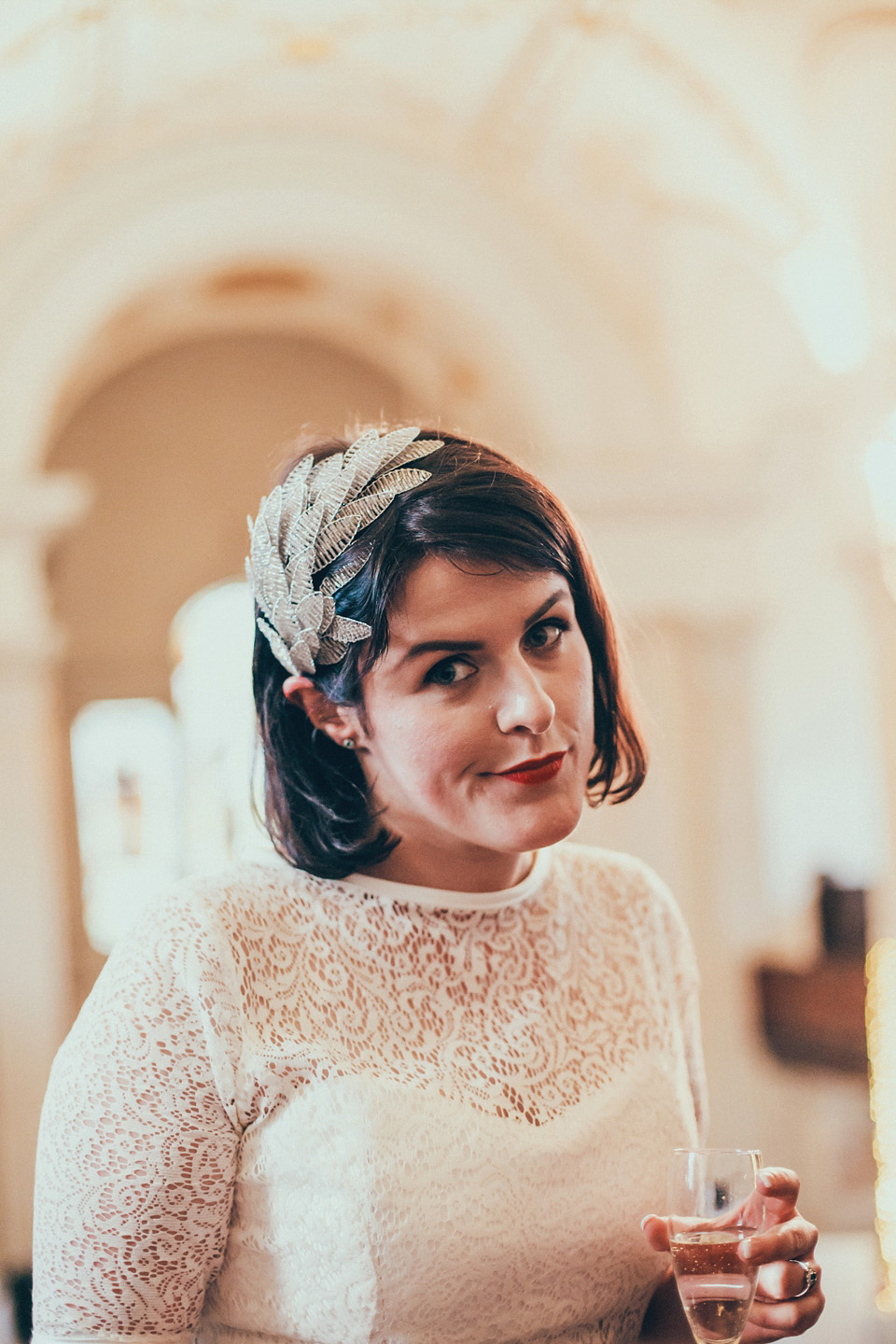 The bride wears green wedding shoes and a 50's style dress from Flossy and Dossy for her Glasgow wedding. Photography by John Elphinstone-Stirling.