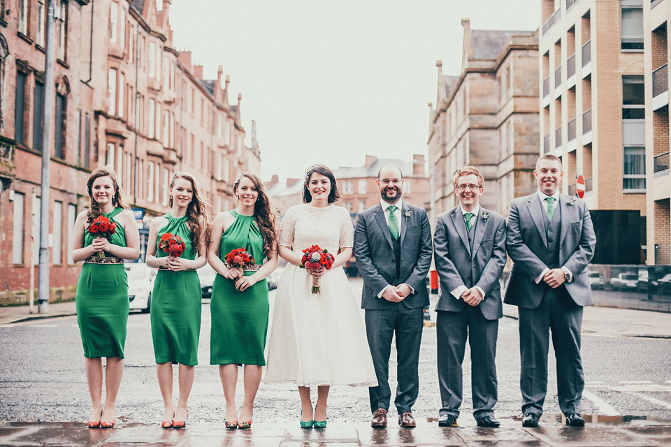 The bride wears green wedding shoes and a 50's style dress from Flossy and Dossy for her Glasgow wedding. Photography by John Elphinstone-Stirling.