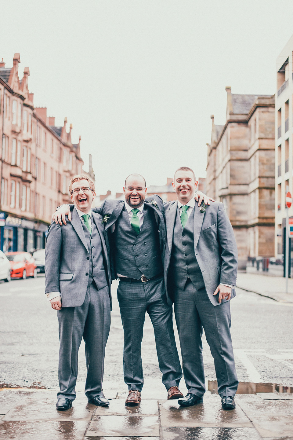 The bride wears green wedding shoes and a 50's style dress from Flossy and Dossy for her Glasgow wedding. Photography by John Elphinstone-Stirling.