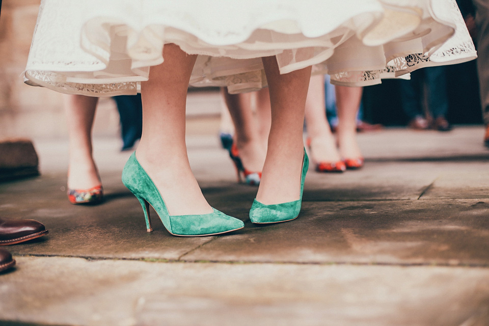 The bride wears green wedding shoes and a 50's style dress from Flossy and Dossy for her Glasgow wedding. Photography by John Elphinstone-Stirling.