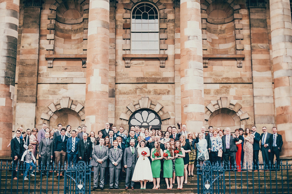 The bride wears green wedding shoes and a 50's style dress from Flossy and Dossy for her Glasgow wedding. Photography by John Elphinstone-Stirling.