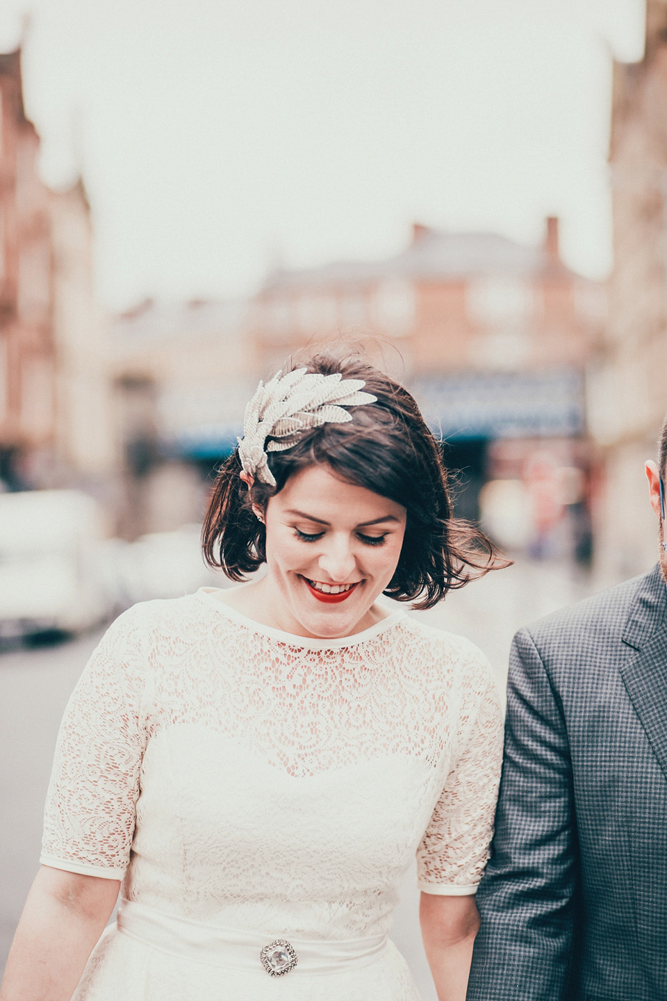 The bride wears green wedding shoes and a 50's style dress from Flossy and Dossy for her Glasgow wedding. Photography by John Elphinstone-Stirling.