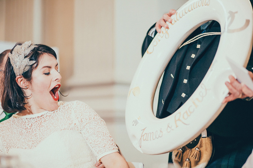 The bride wears green wedding shoes and a 50's style dress from Flossy and Dossy for her Glasgow wedding. Photography by John Elphinstone-Stirling.