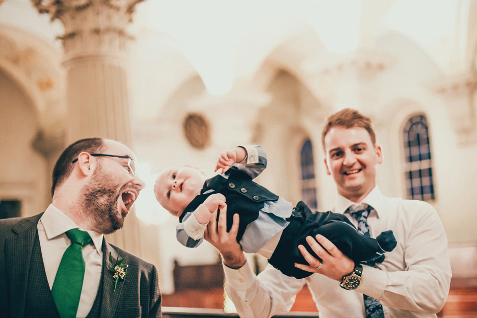 The bride wears green wedding shoes and a 50's style dress from Flossy and Dossy for her Glasgow wedding. Photography by John Elphinstone-Stirling.