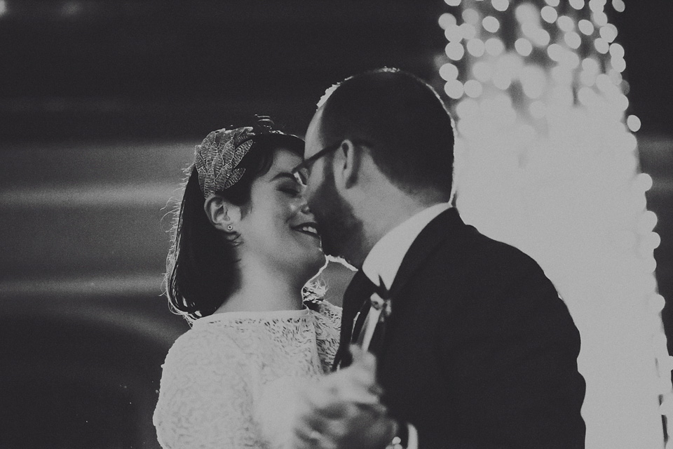 The bride wears green wedding shoes and a 50's style dress from Flossy and Dossy for her Glasgow wedding. Photography by John Elphinstone-Stirling.