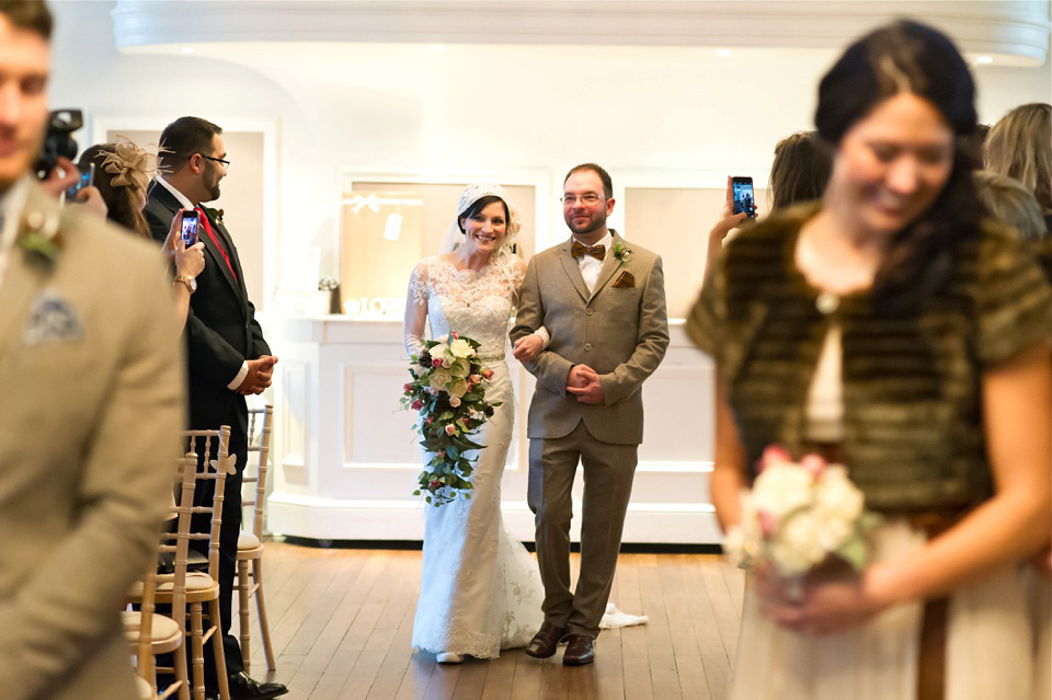 A charming winter wedding at The George in Rye with a bride wearing a Juliet cap veil. Images by The Edge Photography.