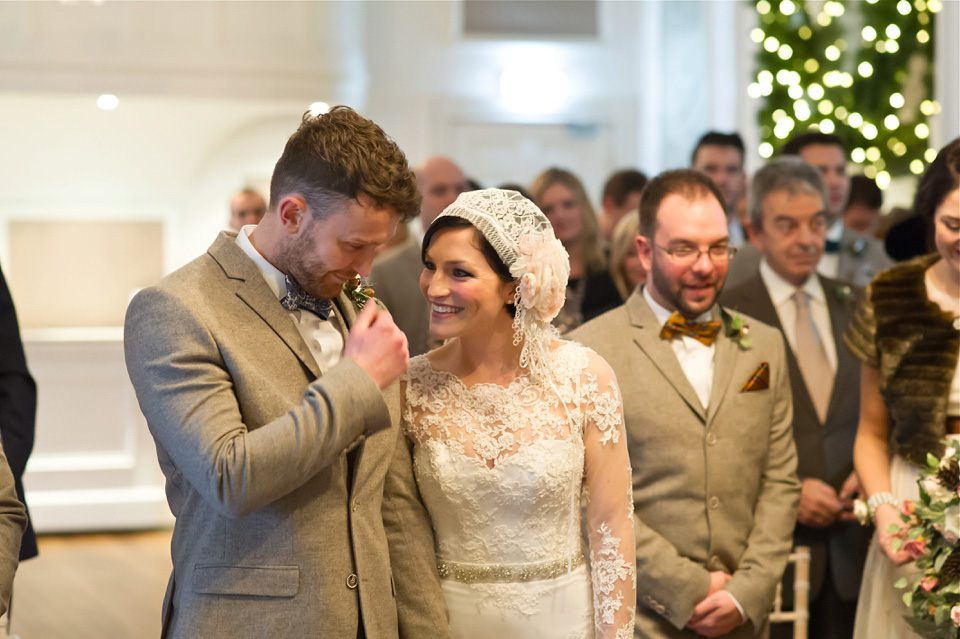 A charming winter wedding at The George in Rye with a bride wearing a Juliet cap veil. Images by The Edge Photography.
