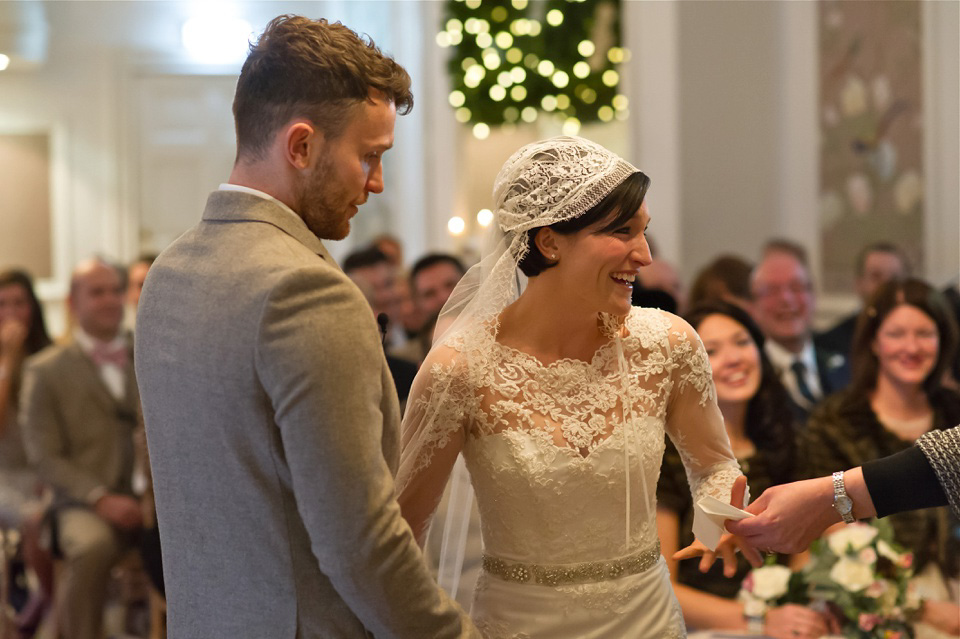 A charming winter wedding at The George in Rye with a bride wearing a Juliet cap veil. Images by The Edge Photography.