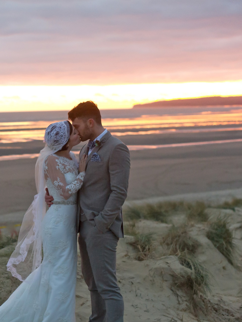 A charming winter wedding at The George in Rye with a bride wearing a Juliet cap veil. Images by The Edge Photography.