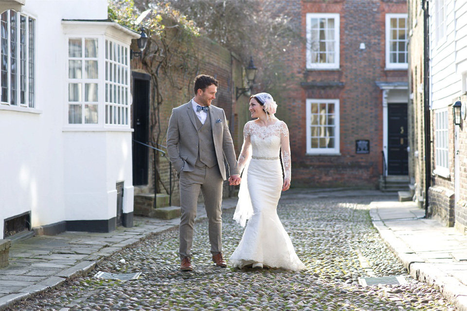 A charming winter wedding at The George in Rye with a bride wearing a Juliet cap veil. Images by The Edge Photography.