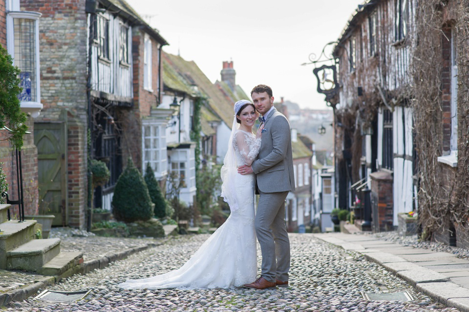A charming winter wedding at The George in Rye with a bride wearing a Juliet cap veil. Images by The Edge Photography.