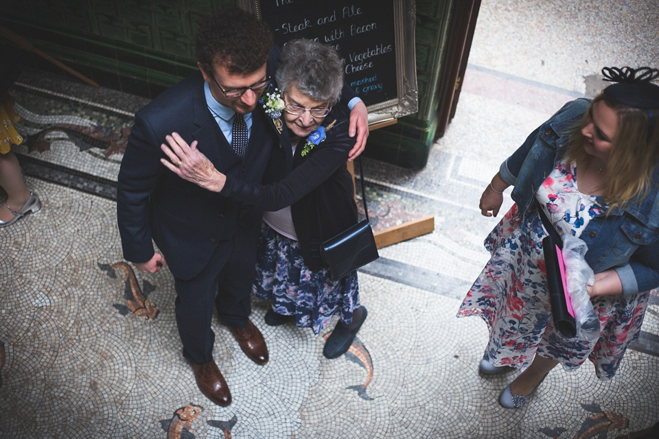 The bride wears a Charlotte Balbier gown for her 50's vintage inspired pale blue wedding at Victoria Baths, Manchester.