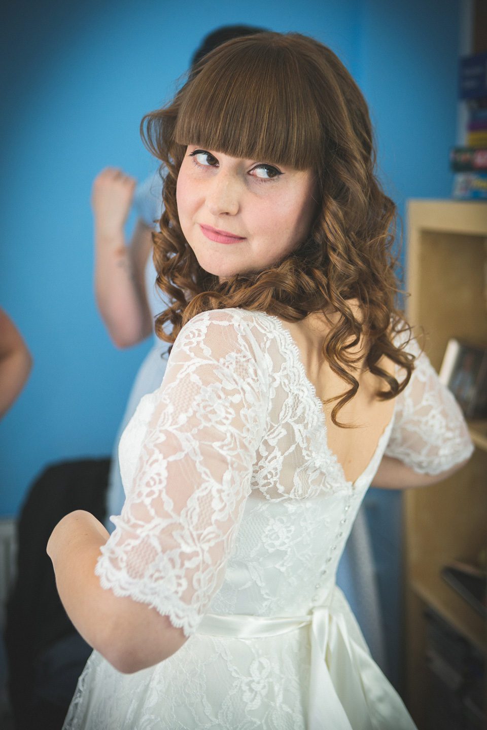 The bride wears a Charlotte Balbier gown for her 50's vintage inspired pale blue wedding at Victoria Baths, Manchester.