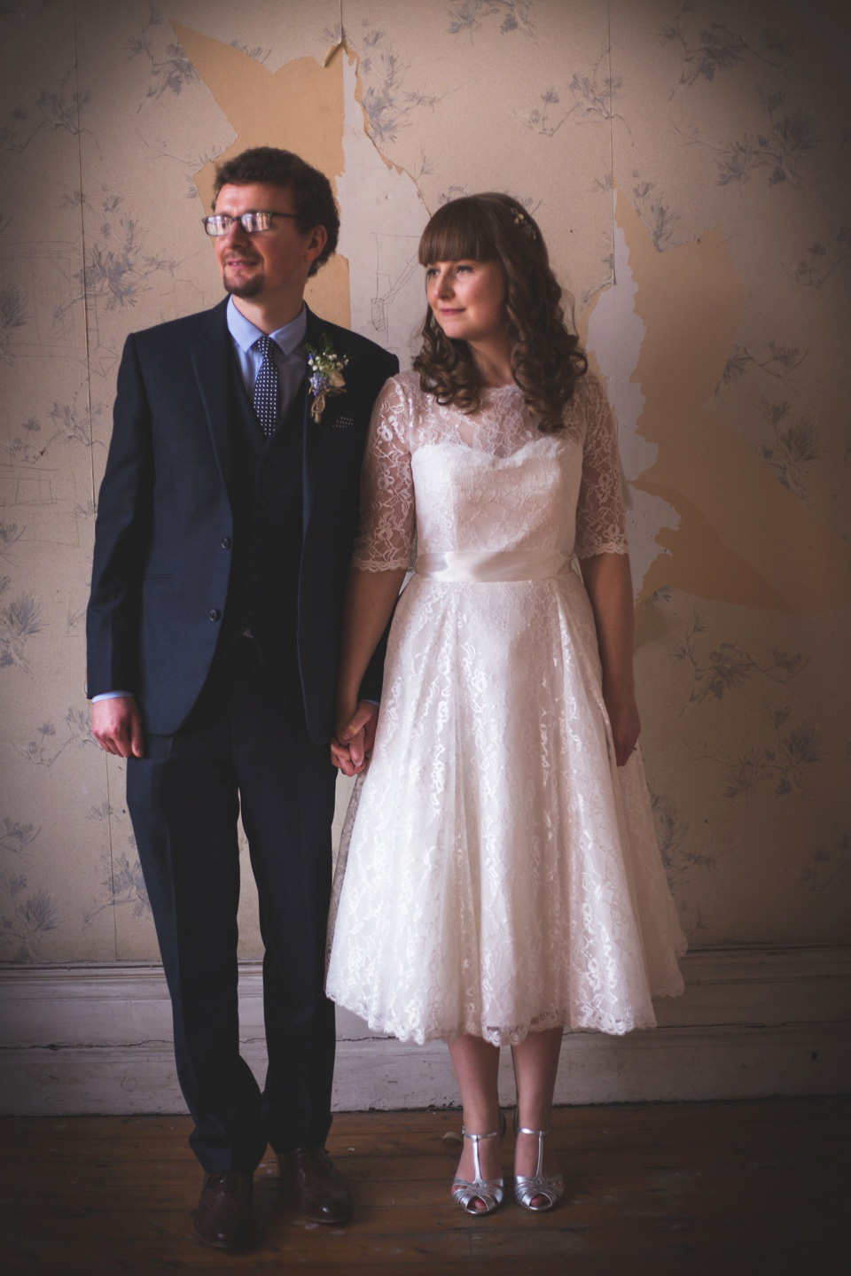 The bride wears a Charlotte Balbier gown for her 50's vintage inspired pale blue wedding at Victoria Baths, Manchester.