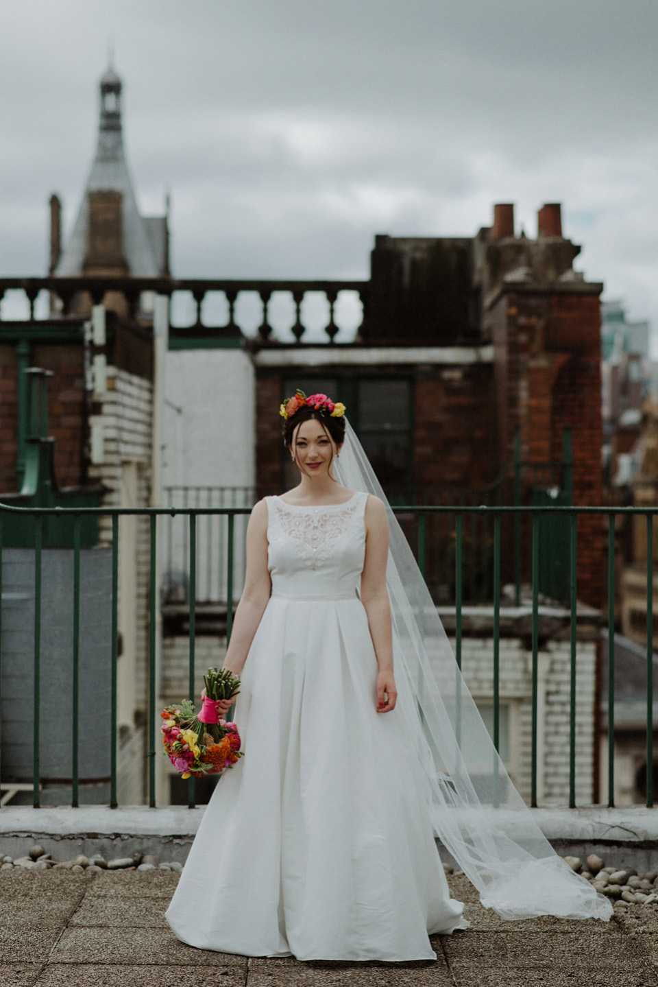 A colourful David Bowie and Wes Anderson inspired wedding in Glasgow. The bride wore a gown from Davids Bridal. Photography by The Kitcheners.